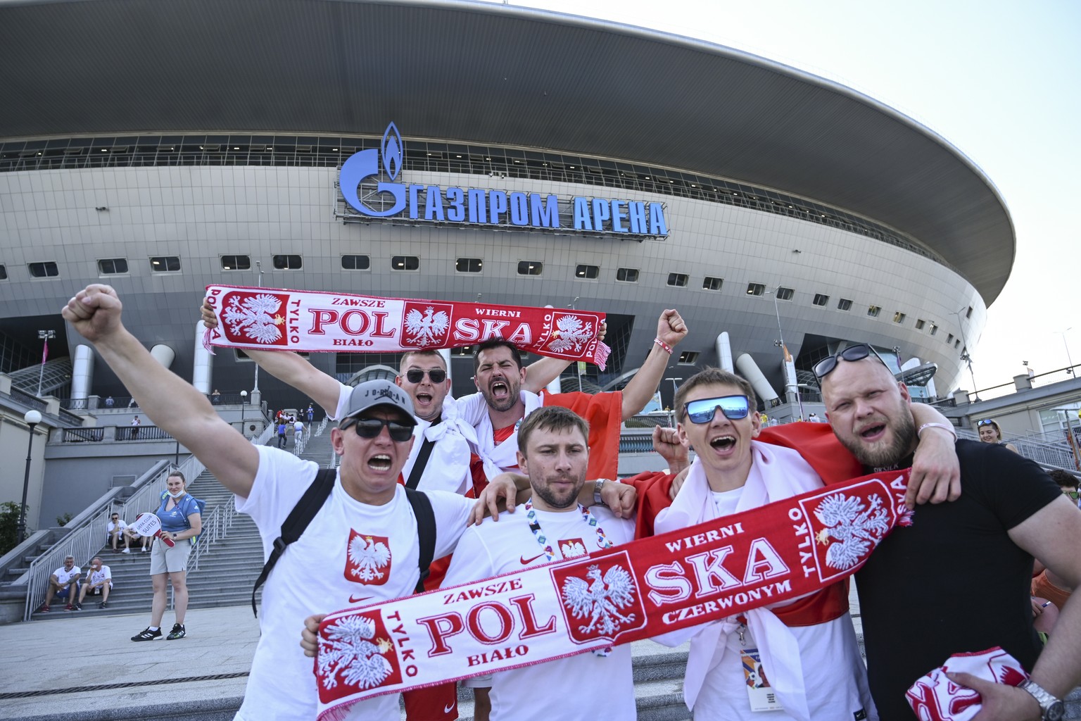 Poland fans cheer prior to the Euro 2020 soccer championship group D match between Sweden and Poland, outside the St. Petersburg stadium in St. Petersburg, Russia, Wednesday, June 23, 2021. (AP Photo/ ...