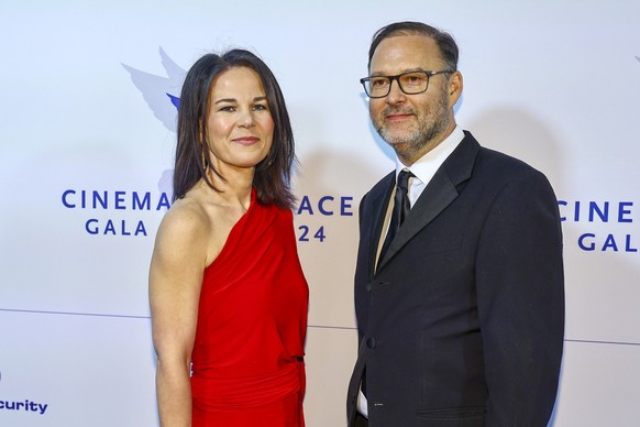 epa11166940 German Foreign Minister Annalena Baerbock and her husband attend the Cinema for Peace gala during the 74th annual Berlin International Film Festival (Berlinale), in Berlin, Germany, 19 Feb ...