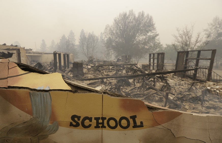 The burned remains of the Paradise Elementary school is seen Friday, Nov. 9, 2018, in Paradise, Calif. Blocks and blocks of homes and businesses in the Northern California town have been destroyed by  ...