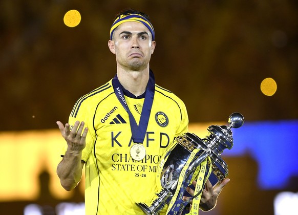 epa12982642 Al-Nassr captain Cristiano Ronaldo poses with the Saudi Pro League trophy after winning the Saudi Pro League match between Al-Nassr and Damac Club in Riyadh, Saudi Arabia, 21 May 2026. Al- ...