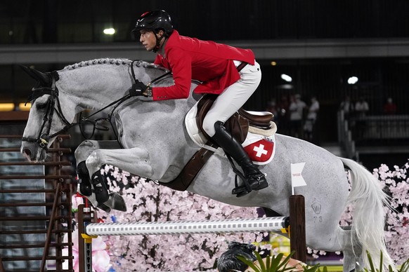 Switzerland&#039;s Martin Fuchs, riding Clooney 51, competes during the equestrian jumping individual qualifying at Equestrian Park in Tokyo at the 2020 Summer Olympics, Tuesday, Aug. 3, 2021, in Toky ...