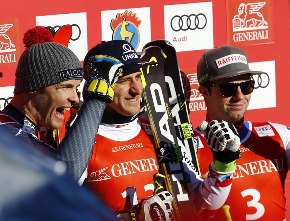 Alpine Skiing - FIS Alpine Skiing World Cup - Men&#039;s Super G - Kitzbuehel, Austria - 20/01/17 - Christof Innerhofer of Italy, Matthias Mayer of Austria and Beat Feuz of Switzerland pose at the fin ...