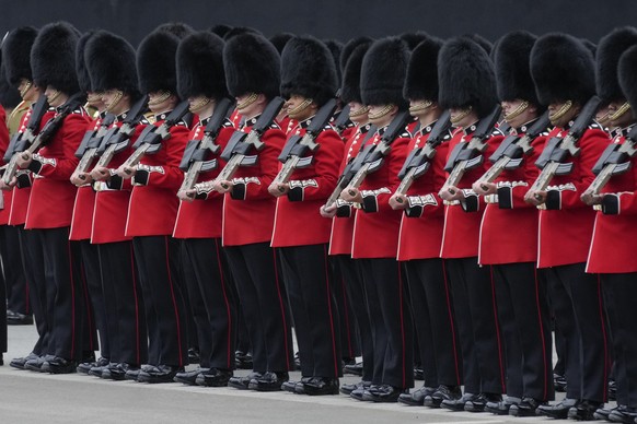 The Queen&#039;s Guard line up at the Palace of Westminster prior to the State Opening of Parliament in London, Tuesday, May 10, 2022. Buckingham Palace said Queen Elizabeth II will not attend the ope ...
