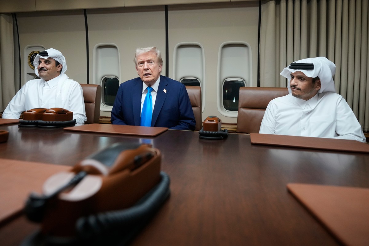 President Donald Trump, center, meets with Emir of Qatar Sheikh Tamim bin Hamad al-Thani, left, and Qatar Prime Minister and Foreign Minister Sheikh Mohammed bin Abdulrahman bin Jassim Al Thani aboard ...