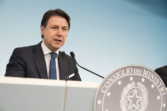 epa08285783 A handout picture made available by the Chigi Palace (Palazzo Chigi) Press Office shows Italian Prime Minister Giuseppe Conte holding a press conference about the novel coronavirus emergen ...