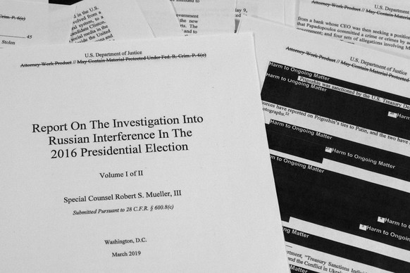 FILE - In this April 18, 2019, file photo, special counsel Robert Mueller&#039;s redacted report on Russian interference in the 2016 presidential election is photographed in Washington. The Mueller Re ...