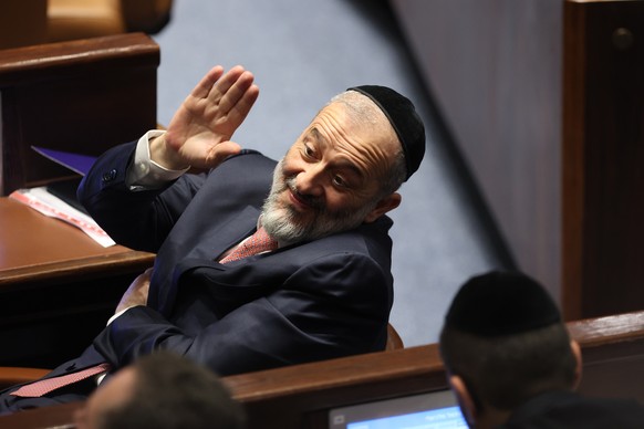 Member of Knesset Aryeh Deri waves during the swearing-in ceremony for Israeli lawmakers at the Knesset, Israel&#039;s parliament, in Jerusalem, Tuesday, Nov. 15, 2022. Israeli lawmakers were sworn in ...