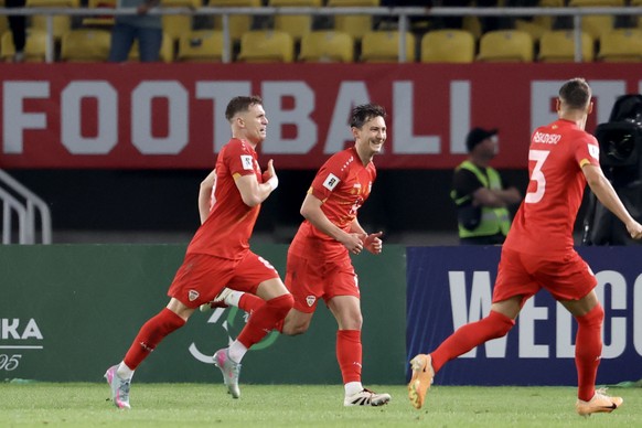 epa12161257 Ezgjan Alioski (L) of North Macedonia celebrates with teammates after scoring the 1-1 equalizing goal during the FIFA World Cup 26 qualification match between North Macedonia and Belgium i ...