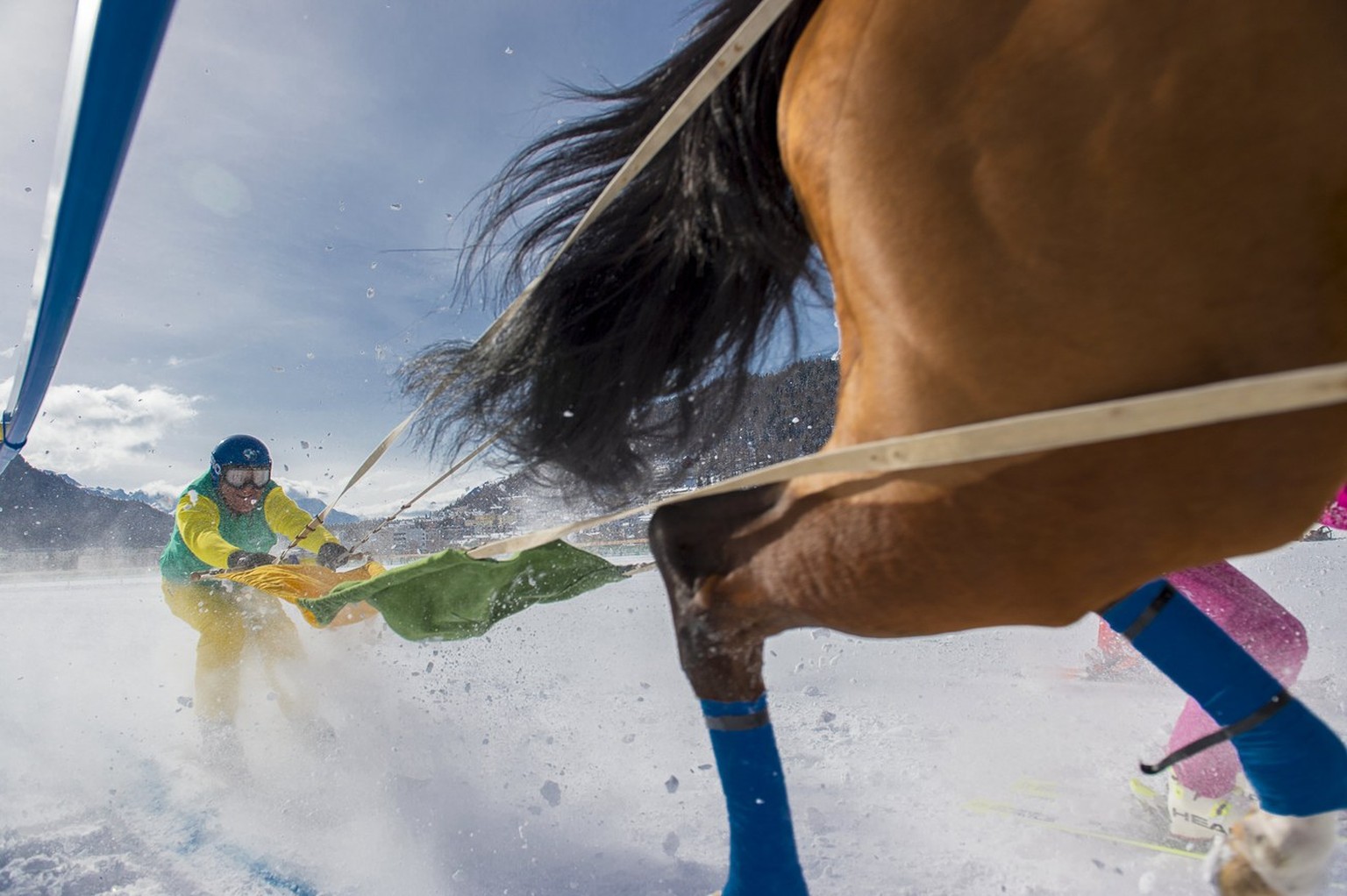 epa06254086 YEARENDER 2017 FEBRUARY..A rider competes during the Skikjoering Credit Suisse GP of Celerina 2&#039;700m on the frozen lake of St. Moritz on the first weekend of the White Turf horse race ...
