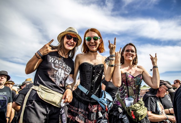 epaselect epa06922205 Visitors attend the Wacken Open Air festival, in Wacken, Germany, 01 August 2018. From 02 to 04 August, more than 70,000 heavy metal music fans are expected in the little village ...