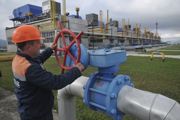 FILE - A worker at a Ukrainian gas station Volovets in western Ukraine Wednesday, in Oct. 7, 2015. More than a decade ago, the alarm was raised by two brief shutoffs of the gas pipelines through Ukrai ...