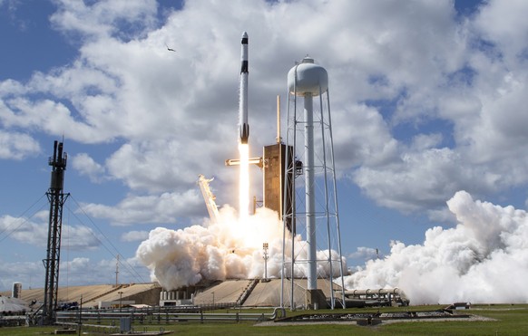 epa10225936 A handout photo made available by NASA shows a SpaceX Falcon 9 rocket carrying the company's Crew Dragon spacecraft launching on NASA's SpaceX Crew-5 mission to the International Space Sta ...