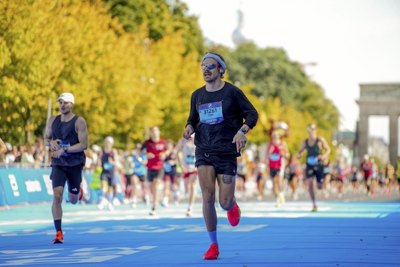 Harry Styles, center, competes in the Berlin Marathon in Berlin, Germany, Sept. 21, 2025 (Sportfotograf via AP)
Germany Berlin Marathon Styles