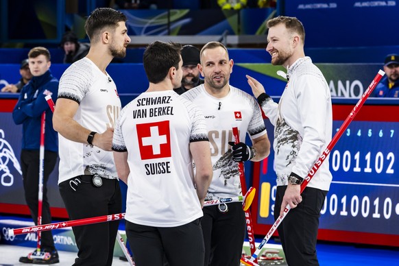Pablo Lachat-Couchepin, Benoit Schwarz-van Berkel, Sven Michel and Yannick Schwaller of Switzerland, from left to right, celebrate the victory during the men's curling round robin game between Sw ...