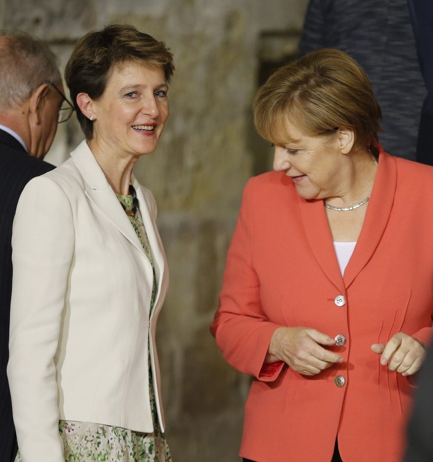 epa05021142 German Chancellor Angela Merkel (R) talks with Swiss Confederation President Simonetta Sommaruga (L), during the Valletta Summit on Migration in Valletta, Malta, 11 November 2015. European ...