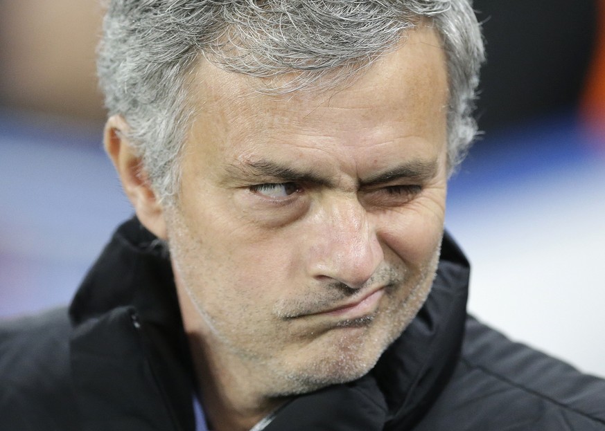 Chelsea manager Jose Mourinho grimaces before before the Champions League round of 16 second leg soccer match between Chelsea and Paris Saint Germain at Stamford Bridge stadium in London, Wednesday, M ...