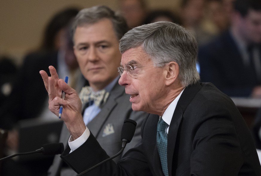 The top U.S. diplomat in Ukraine William Taylor, center, and career Foreign Service officer George Kent, left, testify before the House Intelligence Committee on Capitol Hill in Washington, Wednesday, ...