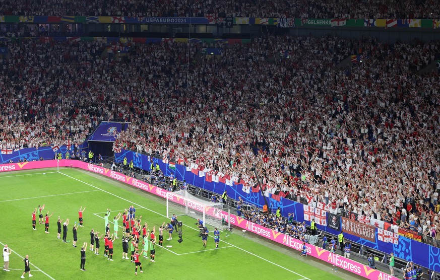 epa11440496 Players of Georgia celebrate winning the UEFA EURO 2024 group F soccer match between Georgia and Portugal, in Gelsenkirchen, Germany, 26 June 2024. EPA/CHRISTOPHER NEUNDORF