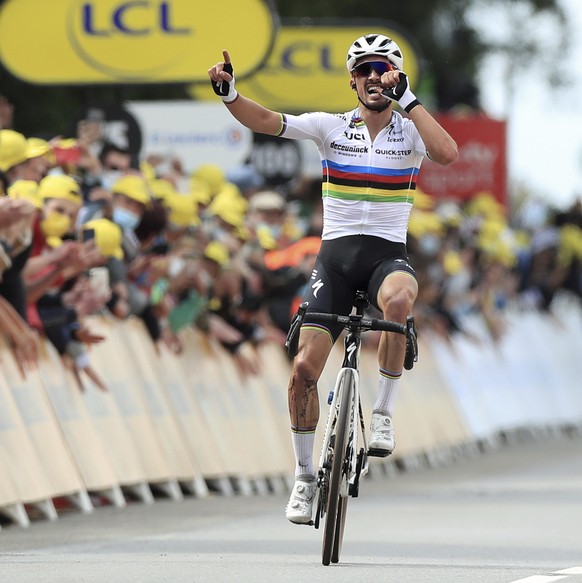 France&#039;s Julien Alaphilippe celebrates as he crosses the finish line of the first stage of the Tour de France cycling race over 197.8 kilometers (122.9 miles) with start in Brest and finish in La ...