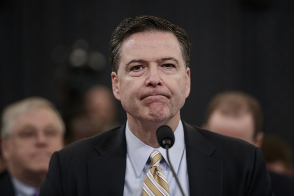 FBI Director James Comey pauses as he testifies on Capitol Hill in Washington, Monday, March 20, 2017, before the House Intelligence Committee hearing on allegations of Russian interference in the 201 ...