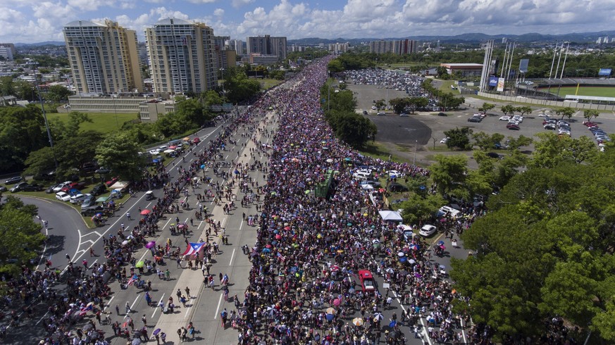 Demonstrators march on Las Americas highway demanding the resignation of governor Ricardo Rossello, in San Juan, Puerto Rico, Monday, July 22, 2019. Protesters are demanding Rossello step down for his ...