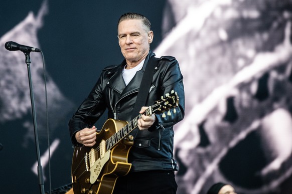 epa11444306 Canadian singer-songwriter and musician Bryan Adams performs at the Tinderbox music festival in Odense, Denmark, 28 June 2024 (issued 29 June 2024). The festival runs from 27 to 29 June 20 ...