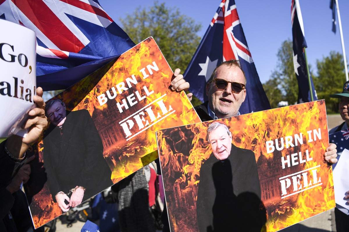epaselect epa08284863 Child sex abuse victim Michael Advocate holds up placards outside the High Court of Australia in Canberra, Australia, 11 March 2020. The full bench of the High Court of Australia ...
