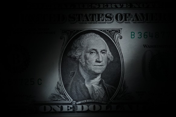 FILE - The likeness of George Washington is seen on a U.S. one dollar bill, March 13, 2023, in Marple Township, Pa. (AP Photo/Matt Slocum, File)
Trump Tariffs Falling Dollar