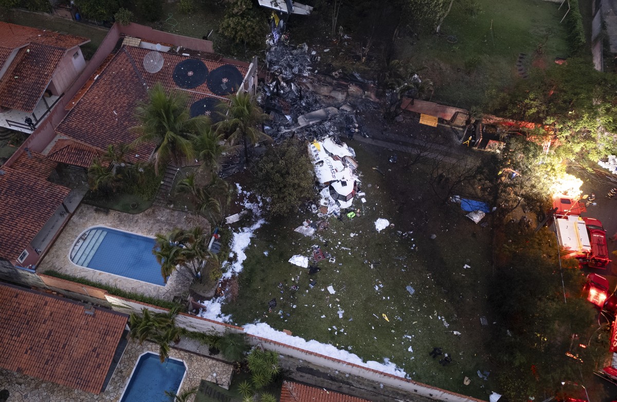 epa11541297 Aerial view of the site where a Voepass airline plane crashed, in Vinhedo, Brazil, 09 August 2024. A plane with 62 people on board crashed on 09 August in a residential area of the Brazili ...