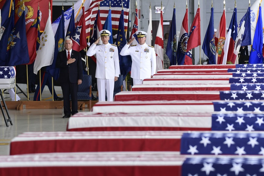 Vice President Mike Pence, left, Commander of U.S. Indo-Pacific Command Adm. Phil Davidson, center, and Rear Adm. Jon Kreitz, deputy director of the POW/MIA Accounting Agency, attend at a ceremony mar ...