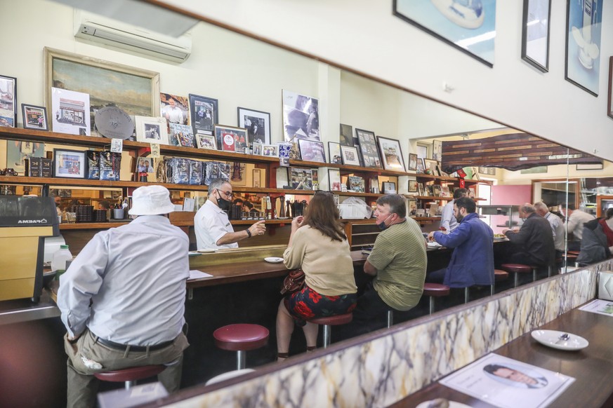 Customers are seen reflected in a mirror dining inside at Pellegrini&#039;s Espresso Bar in Melbourne, Australia, Wednesday, Oct. 28, 2020. In Melbourne, Australia&#039;s former coronavirus hot spot,  ...