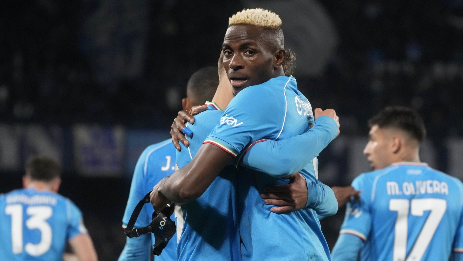Napoli&#039;s Victor Osimhen celebrates with team mates after scoring his side&#039;s opening goal during the Champions League, round of 16, first leg soccer match between SSC Napoli and FC Barcelona  ...