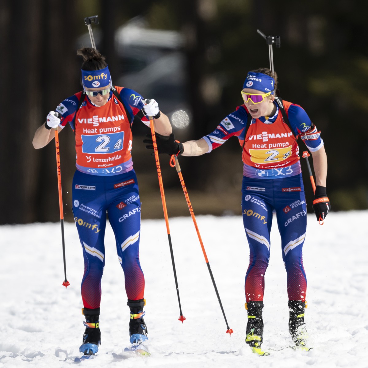 Julia Simon of France, left, and Justine Braisaz-Bouchet of France, right, in action during the women?s relay race at the IBU Biathlon World Championships, on Saturday, February 22, 2025, in Lenzerhei ...