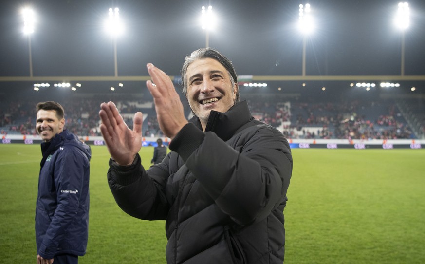 Switzerland&#039;s head coach Murat Yakin, right, and his assitant Vincent Cavin, left, celebrate after directly qualifying for the FIFA World Cup Qatar 2022 after the 2022 FIFA World Cup European Qua ...