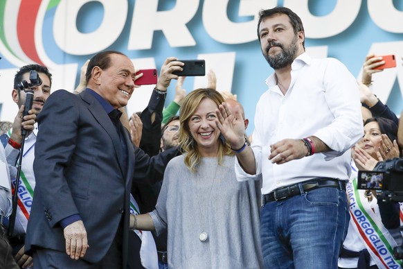 FILE �?? From left, Silvio Berlusconi, Giorgia Meloni and Matteo Salvini address a rally in Rome, Saturday, Oct. 19, 2019. With God, homeland and &quot;natural&quot; family prominent in her political  ...