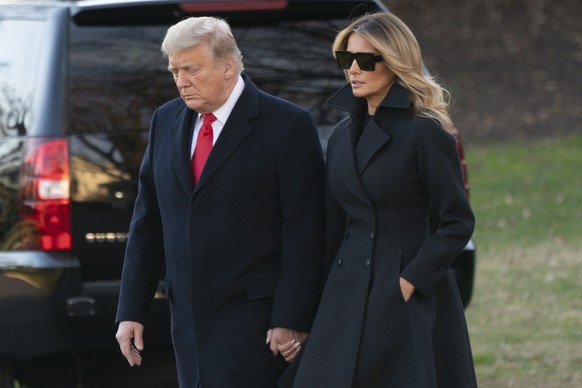 epa08901796 US President Donald J. Trump and First lady Melania Trump (R) depart the White House, in Washington, DC, USA, 23 December 2020, headed out to Mar-a-Lago in Palm Beach, Florida. EPA/Chris K ...