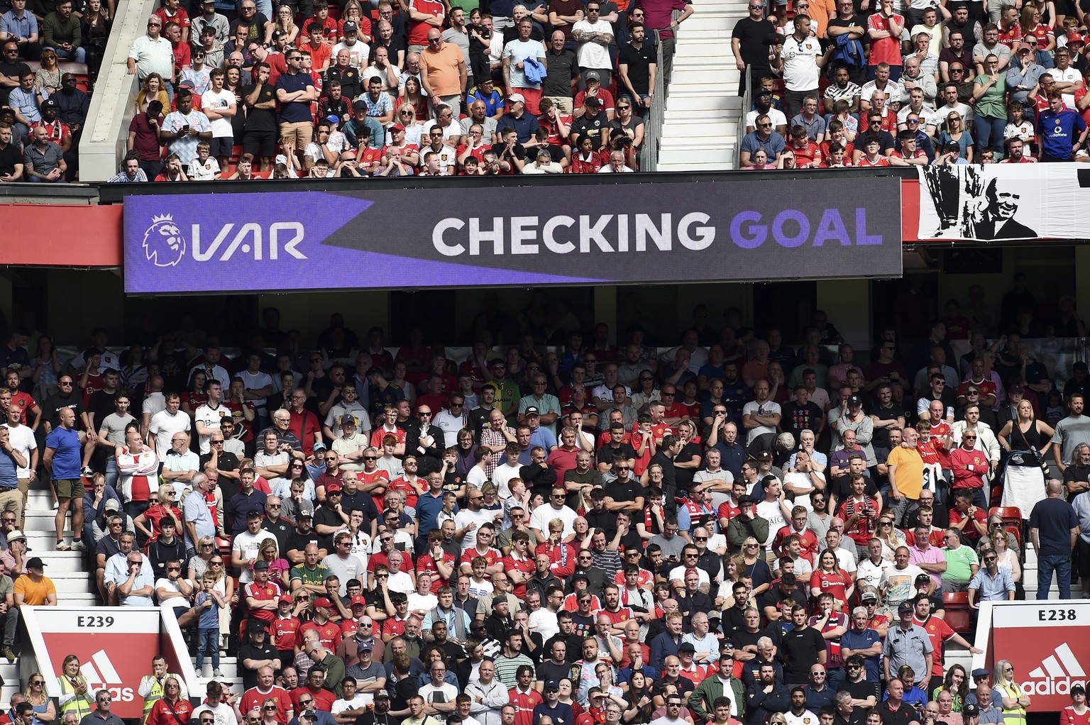 epa10110151 A goal decision of the video assistant referee (VAR) system is announced on a screen at Old Trafford during the English Premier League soccer match between Manchester United and Brighton H ...