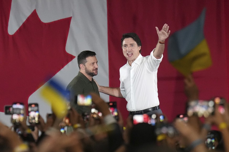 Prime Minister Justin Trudeau, right, introduces Ukrainian President Volodymyr Zelenskyy at a rally at the Fort York Armoury in Toronto on Friday, Sept. 22, 2023. (Nathan Denette/The Canadian Press vi ...
