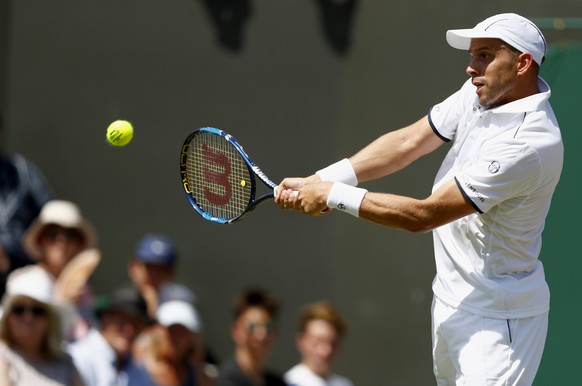 epa06072840 Gilles Muller of Luxembourg in action against Aljaz Bedene of Britain during their third round match for the Wimbledon Championships at the All England Lawn Tennis Club, in London, Britain ...