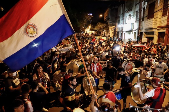 epa09064612 Demonstrators protest against the government in Asuncion, Paraguay, 09 March 2021. Protesters gathered in smaller numbers compared to previous days, to call for the resignation of Presiden ...