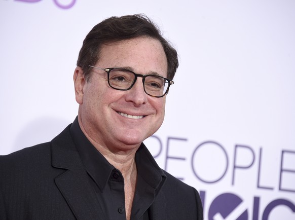 FILE - Bob Saget arrives at the People&#039;s Choice Awards at the Microsoft Theater on Wednesday, Jan. 18, 2017, in Los Angeles. Saget, a comedian and actor known for his role as a widower raising a  ...