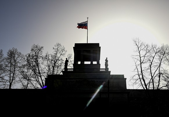 epa09035662 A Russian flag waves on top of the Russian Embassy in Berlin, Germany, 25 February 2021. The German Federeal Prosecutor&#039;s Office on 25 February 2021 charged a man who was hired by a c ...
