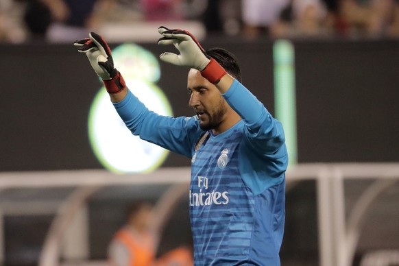 Real Madrid goalkeeper Keylor Navas celebrates a goal by teammate midfielder Marco Asensio against Roma during the first half of an International Champions Cup tournament soccer match, Tuesday, Aug. 7 ...