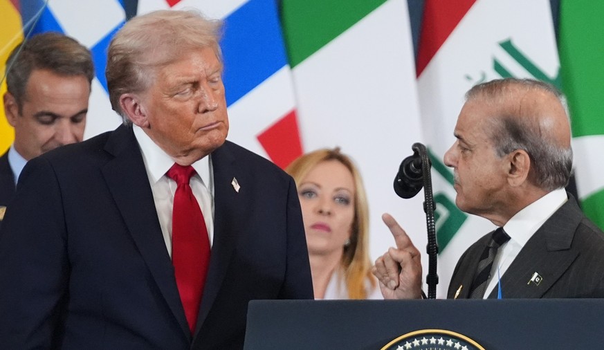 FILE - President Donald Trump, left, listens as Pakistan's Prime Minister Shehbaz Sharif speaks during a summit to support ending the more than two-year Israel-Hamas war in Gaza after a breakthro ...