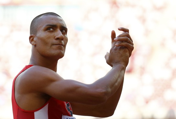 Ashton Eaton of the U.S. claps as he competes in the high jump event of the men&#039;s decathlon during the 15th IAAF World Championships at the National Stadium in Beijing, China, August 28, 2015. RE ...
