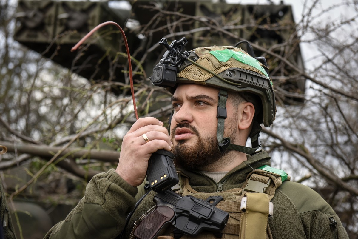 epa10563652 A Ukrainian serviceman of 57th Otaman Kost Hordiienko Separate Motorized Infantry Brigade stands near an anti-aircraft missile launcher Strela at an undisclosed position near the outskirts ...
