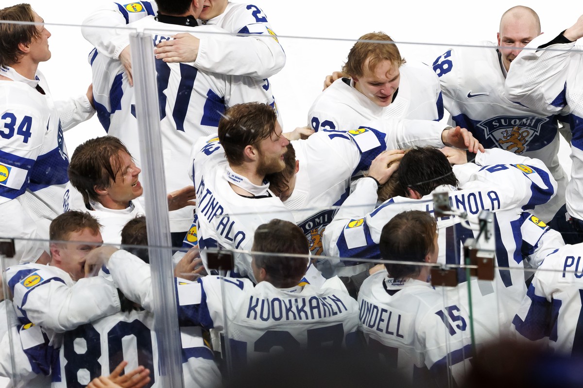 Finland's players celebrate the victory during the 2026 IIHF Men's Ice Hockey World Championship gold medal game between Switzerland and Finland, at the Swiss Life Arena ice hockey stadium,  ...