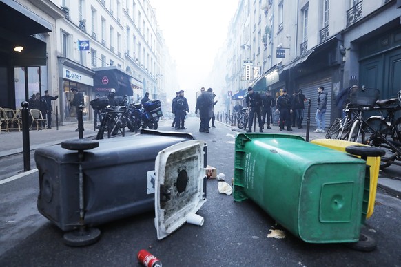 epa10377227 Protesters and French police officers clash after Minister Gerald Darmanin press conference following a shooting incident near a Kurdish cultural centre in Paris, France, 23 December 2022. ...