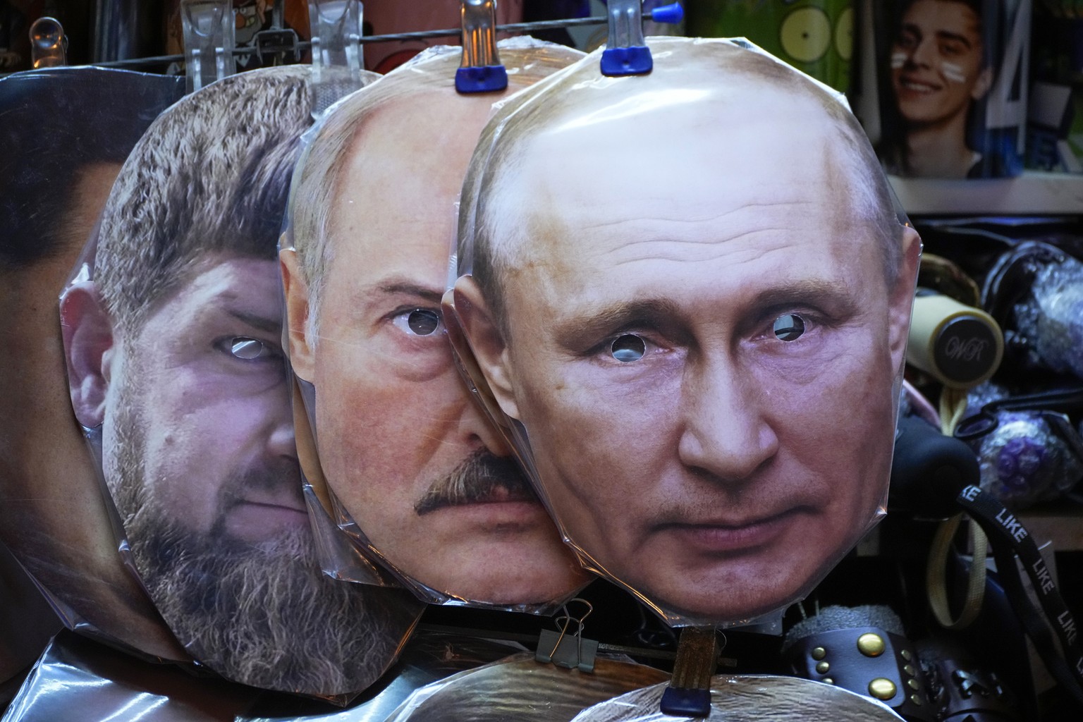 Face masks depicting Russian President Vladimir Putin, right, Belarusian President Alexander Lukashenko, centre and Chechnya&#039;s regional leader Ramzan Kadyrov, left, are displayed among others for ...