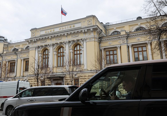 epa12910904 The Russian national flag flies atop the Bank of Russia in Moscow, Russia, 24 April 2026. The Bank of Russia has cut its key rate by 50 basis points for the fifth time in a row, to 14.5 pe ...